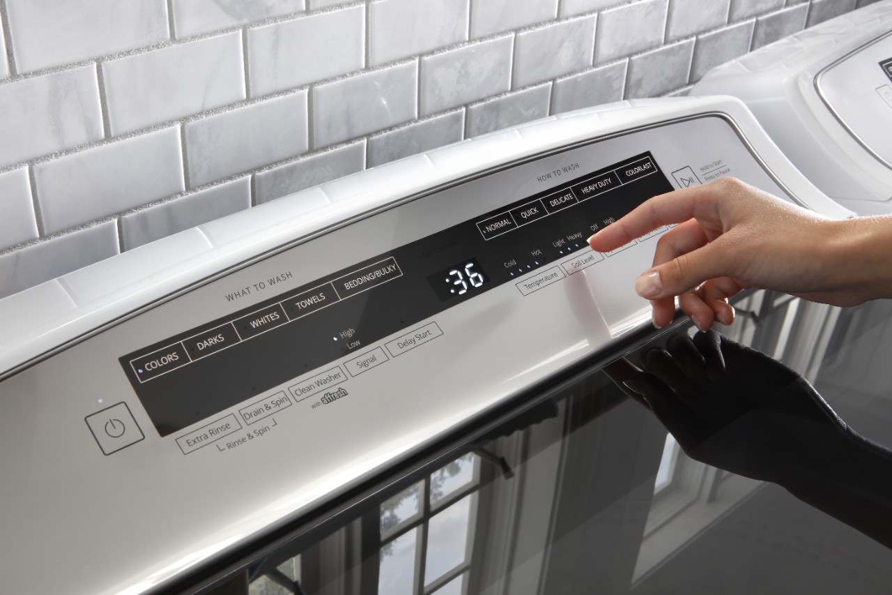Adding fabric softener to the Load & Go™ Plus Dispenser. Adding fabric softener to the Load & Go™ Plus Dispenser.